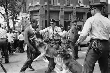 In this May 3, 1963 file photo, a 17-year-old civil rights demonstrator, defying an...