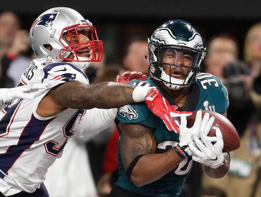 FILE - Philadelphia Eagles' Corey Clement, right, catches a touchdown pass in front of New...