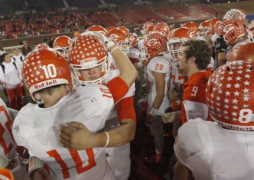 Celina players Preston Morse (10) and quarterback Nathan Elliott hug after they lost to...