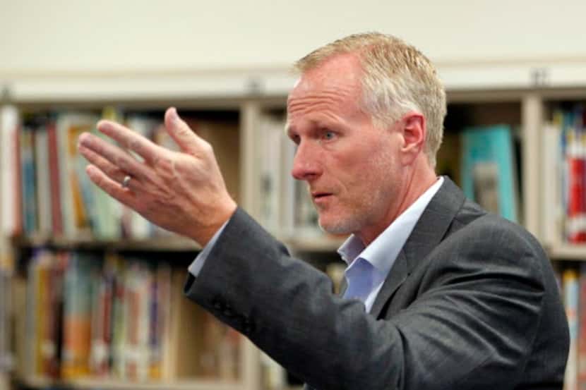 Garland ISD superintendent Bob Morrison talks with faculty during a school visit at Herfurth...
