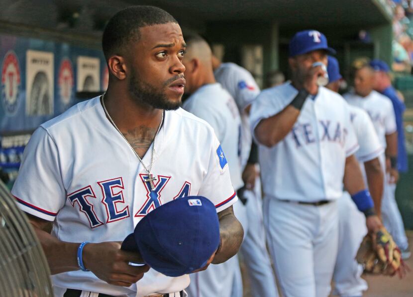 FILE - Left fielder Delino DeShields (left) is pictured in the dugout during a game against...