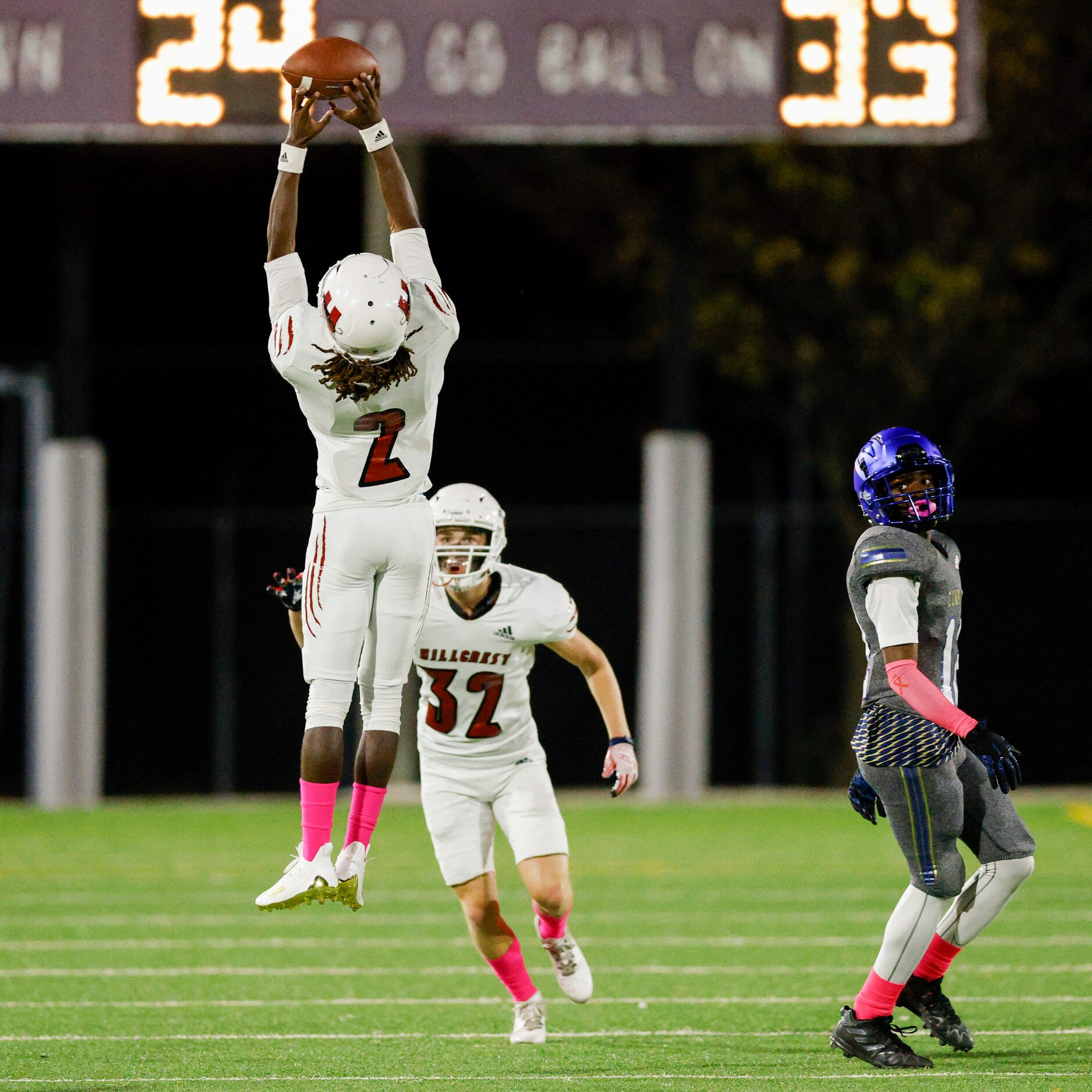 Hillcrest defensive back Reggie Williams (2) attempts to intercept a pass during the first...