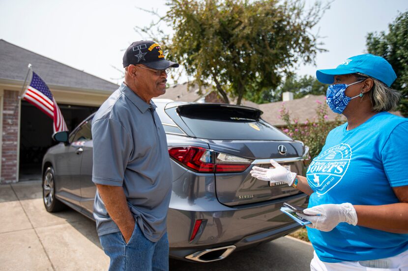 Incumbent State Representative, Democrat, Rhetta Bowers, right, wears a mask and gloves to...