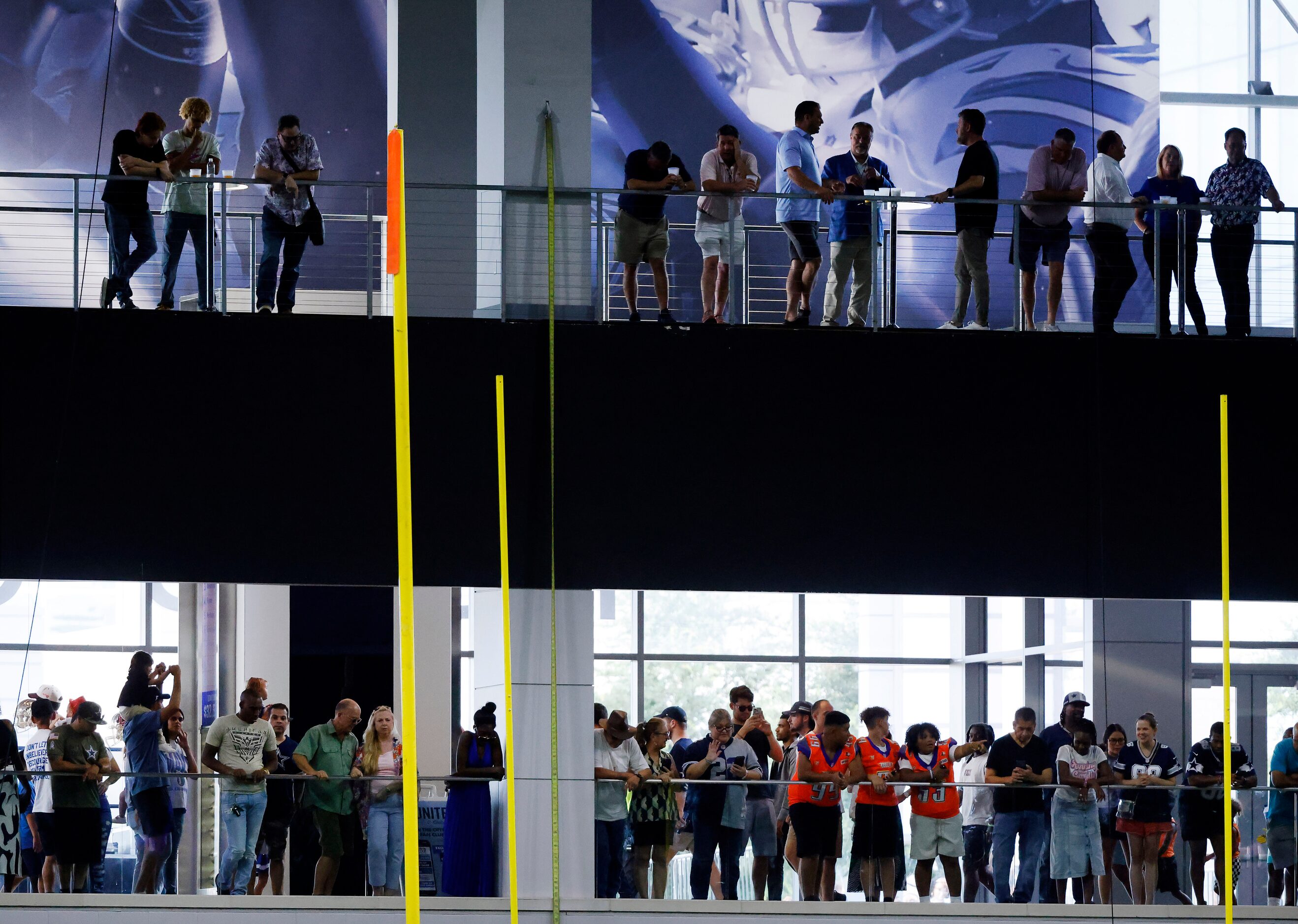 Dallas Cowboys fans watch the Season Kickoff training camp practice from the end zone plazas...