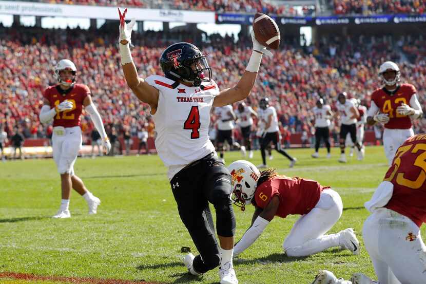 Texas Tech wide receiver Antoine Wesley (4) celebrates in front of Iowa State defensive back...
