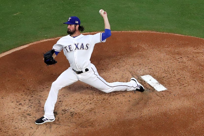 ARLINGTON, TX - SEPTEMBER 11:  Cole Hamels #35 of the Texas Rangers delivers a pitch in the...