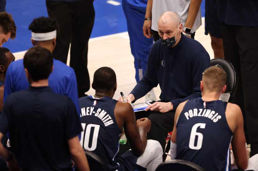Dallas Mavericks head coach Rick Carlisle talks to the team during a timeout in a game...