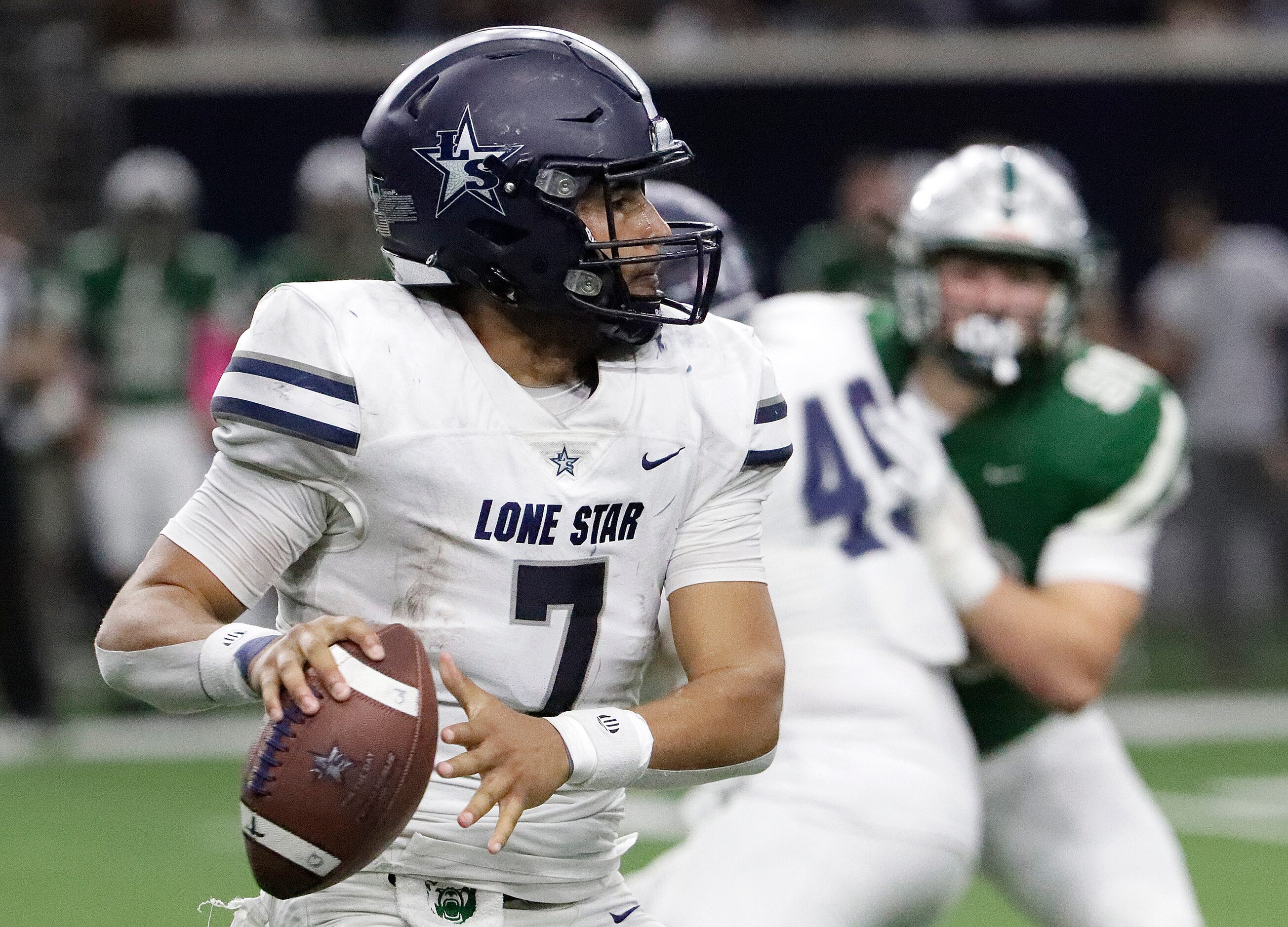 Lone Star High School quarterback Karece Hoyt (7) throws a pass during the first half as...