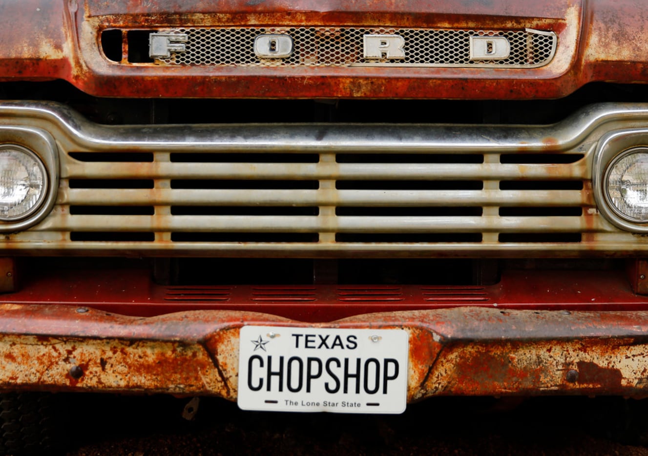 An old Ford pickup sits at the entrance to ChopShop Live in Roanoke, Texas, Friday, July 6,...