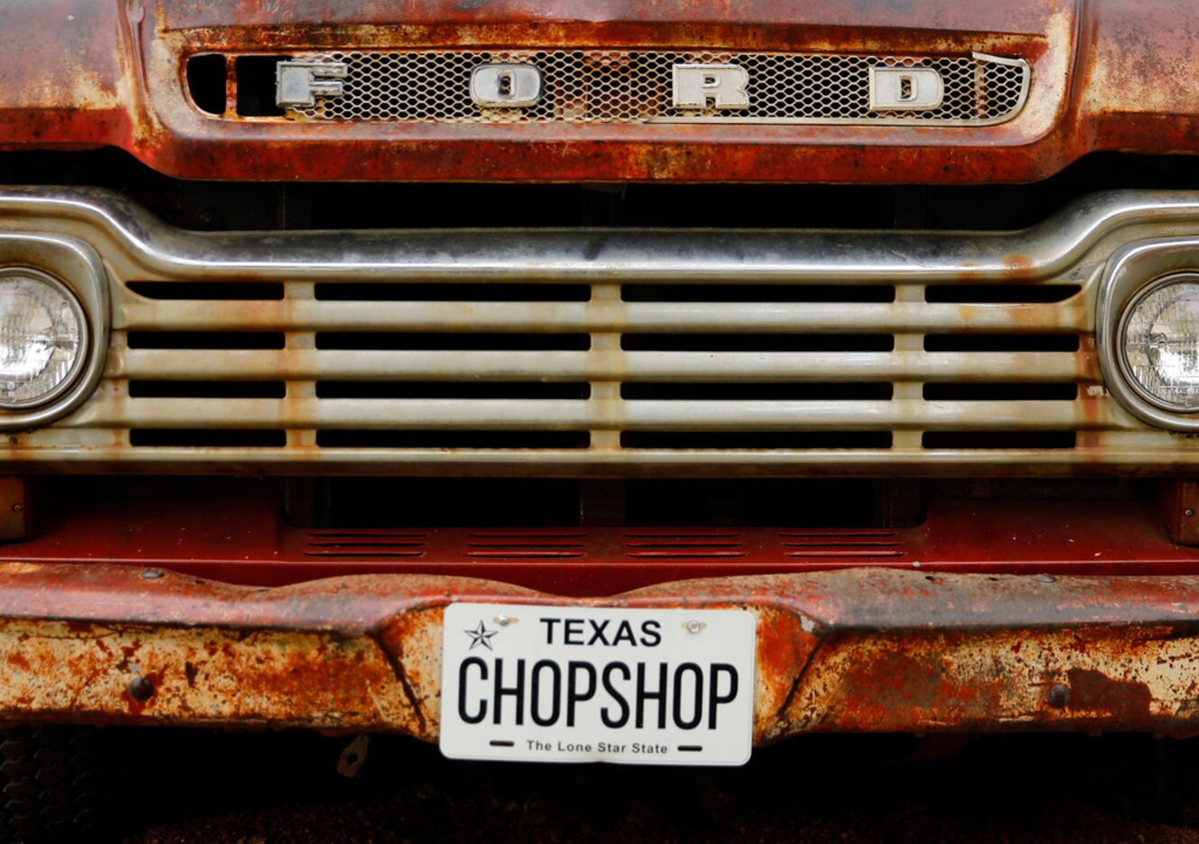 An old Ford pickup sits at the entrance to ChopShop Live in Roanoke, Texas, Friday, July 6,...