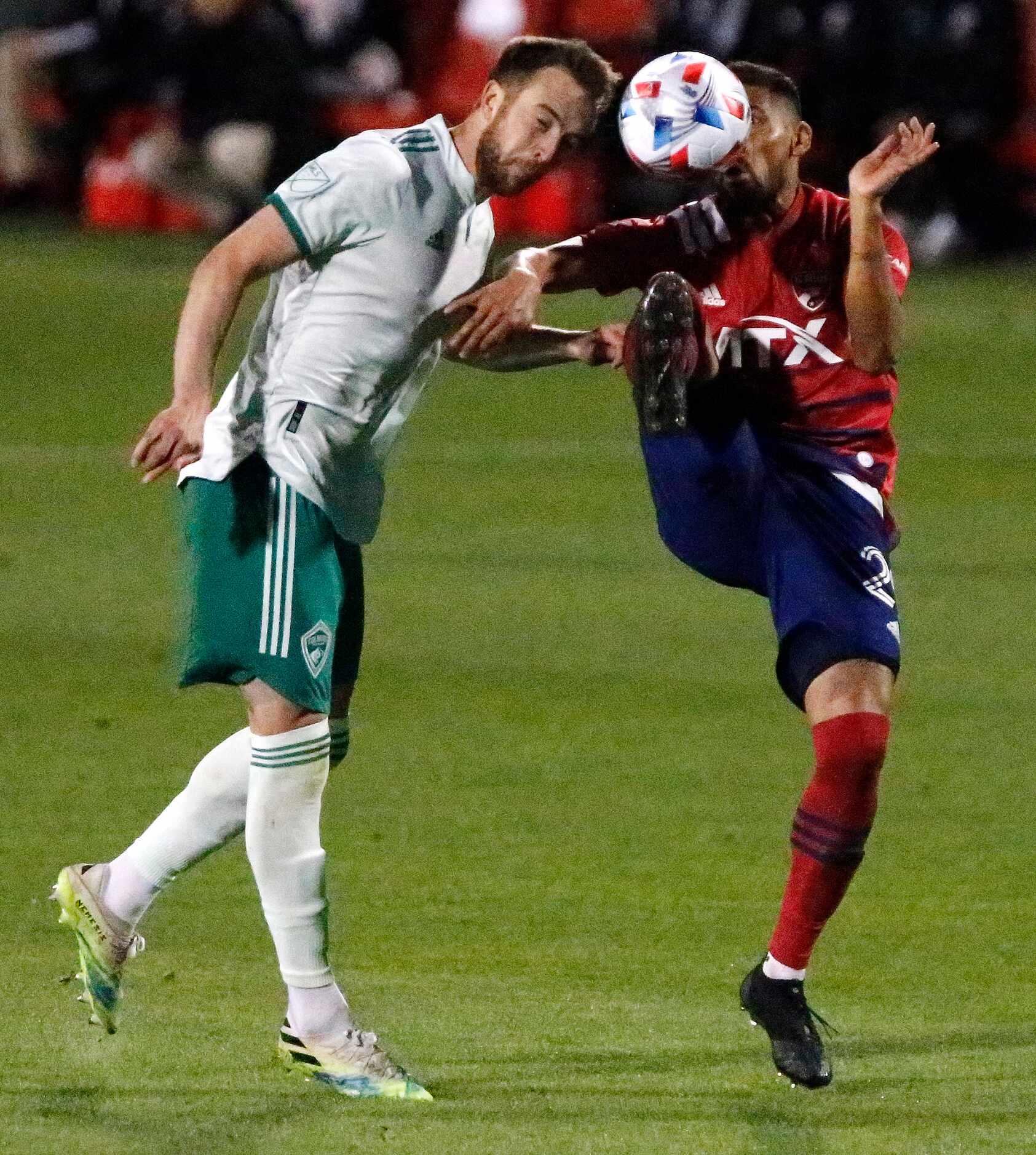 FC Dallas forward Franco Jara (29) and Colorado Rapids defender Danny Wilson (4) collide...