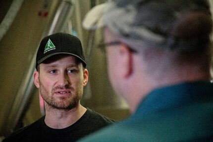 Derek Bruce (left) of Rahr & Sons Brewing Company talks with Gary James at the brewery....