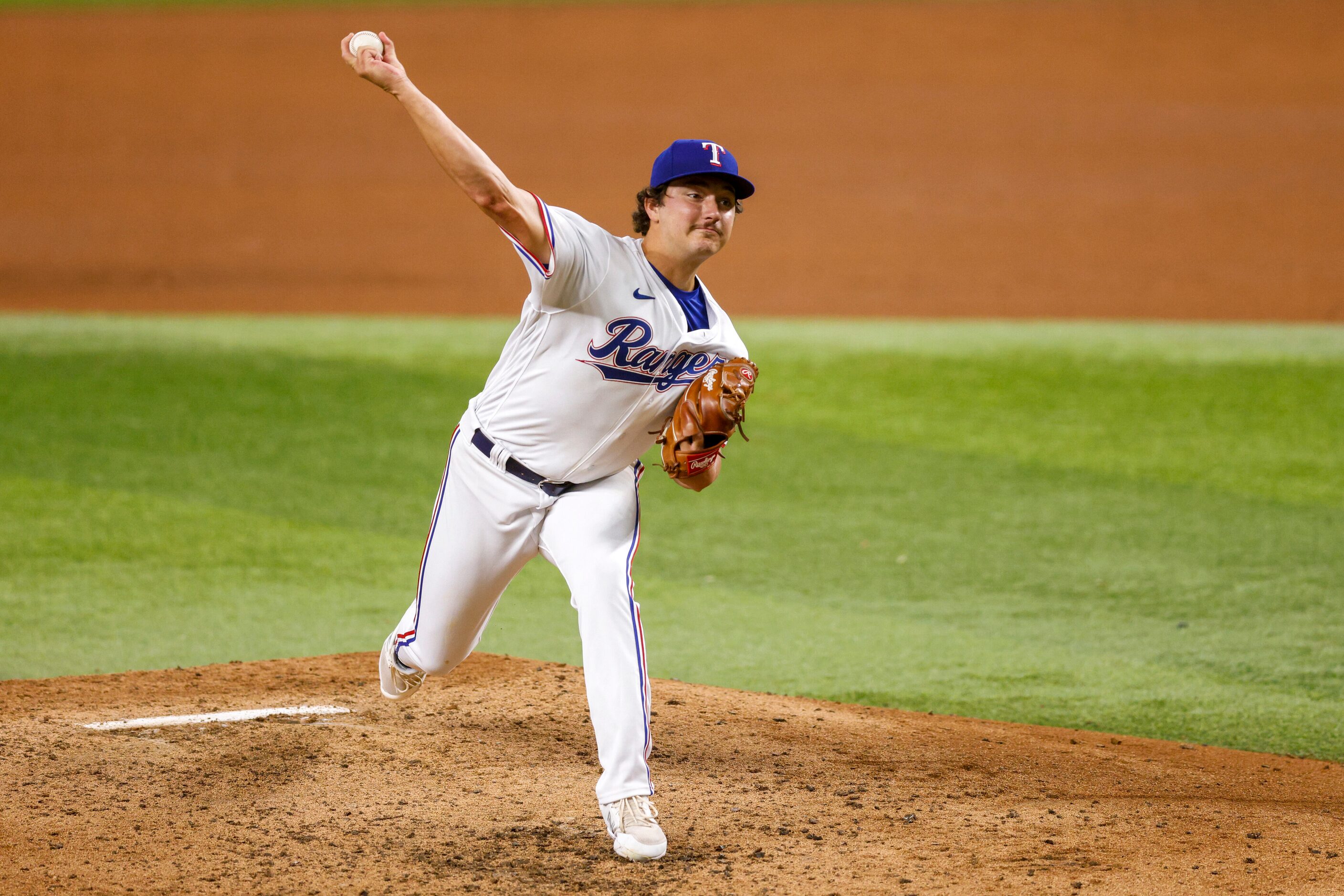 Texas Rangers relief pitcher Owen White (43) delivers a pitch during the sixth inning of a...