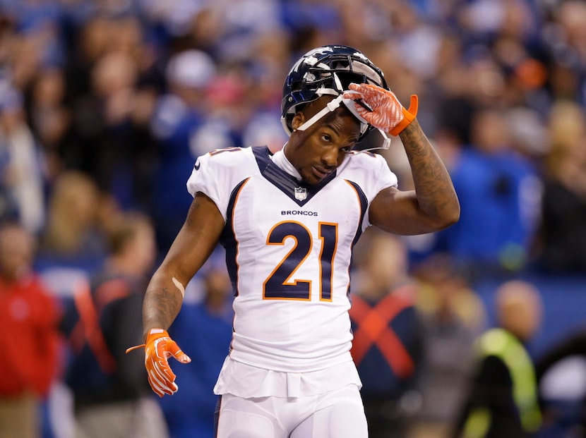 Denver Broncos cornerback Aqib Talib (21) takes off his helmet during the first half of an...