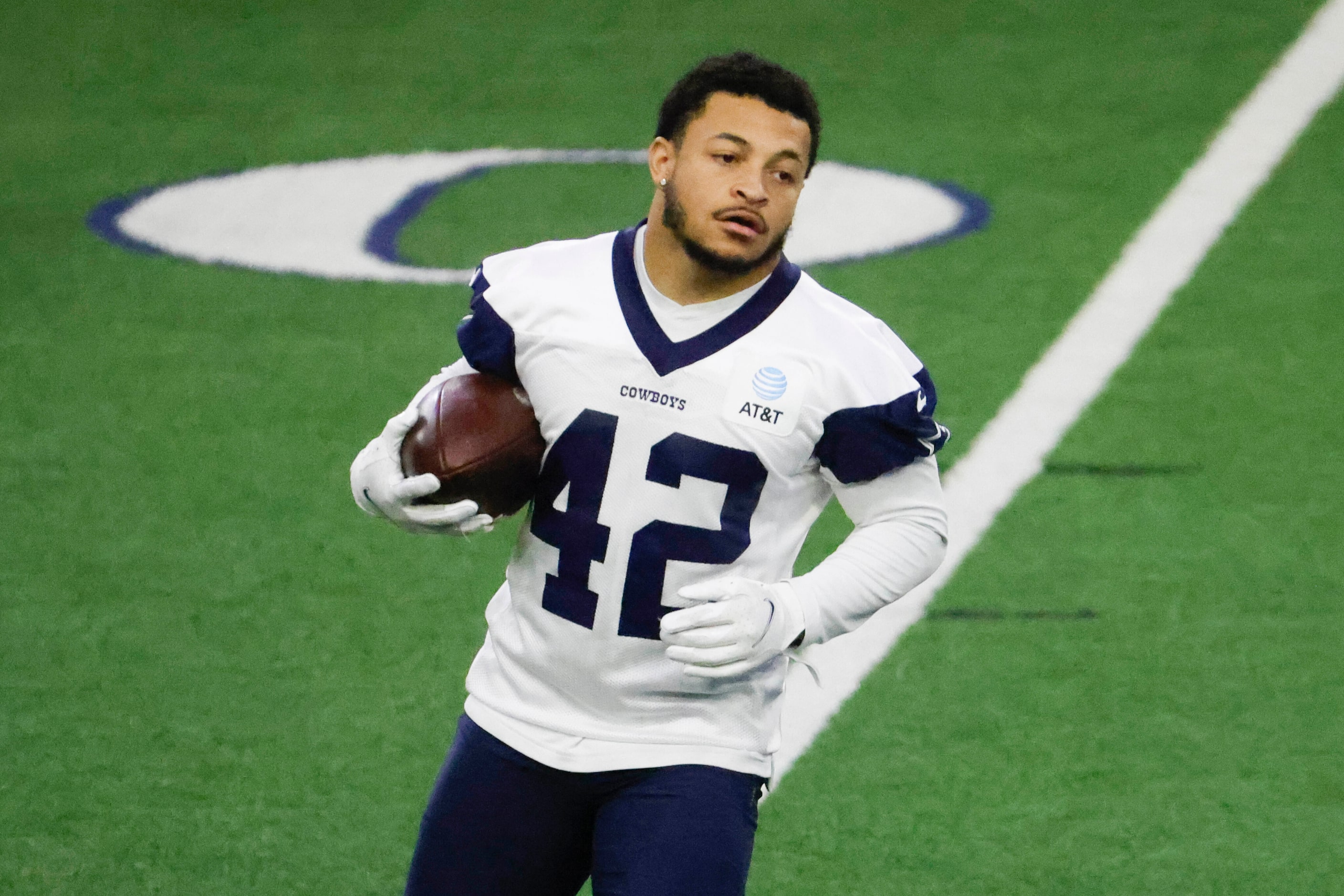 Dallas Cowboys running back Deuce Vaughn runs after catching a ball during a mini camp...