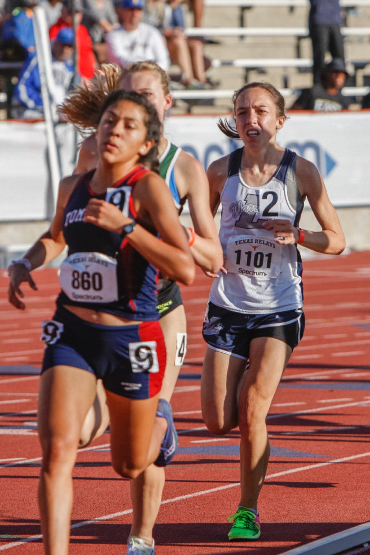 Liberty Christian's Elizabeth Reneau, right, competes in the girls 1600 meter run during the...