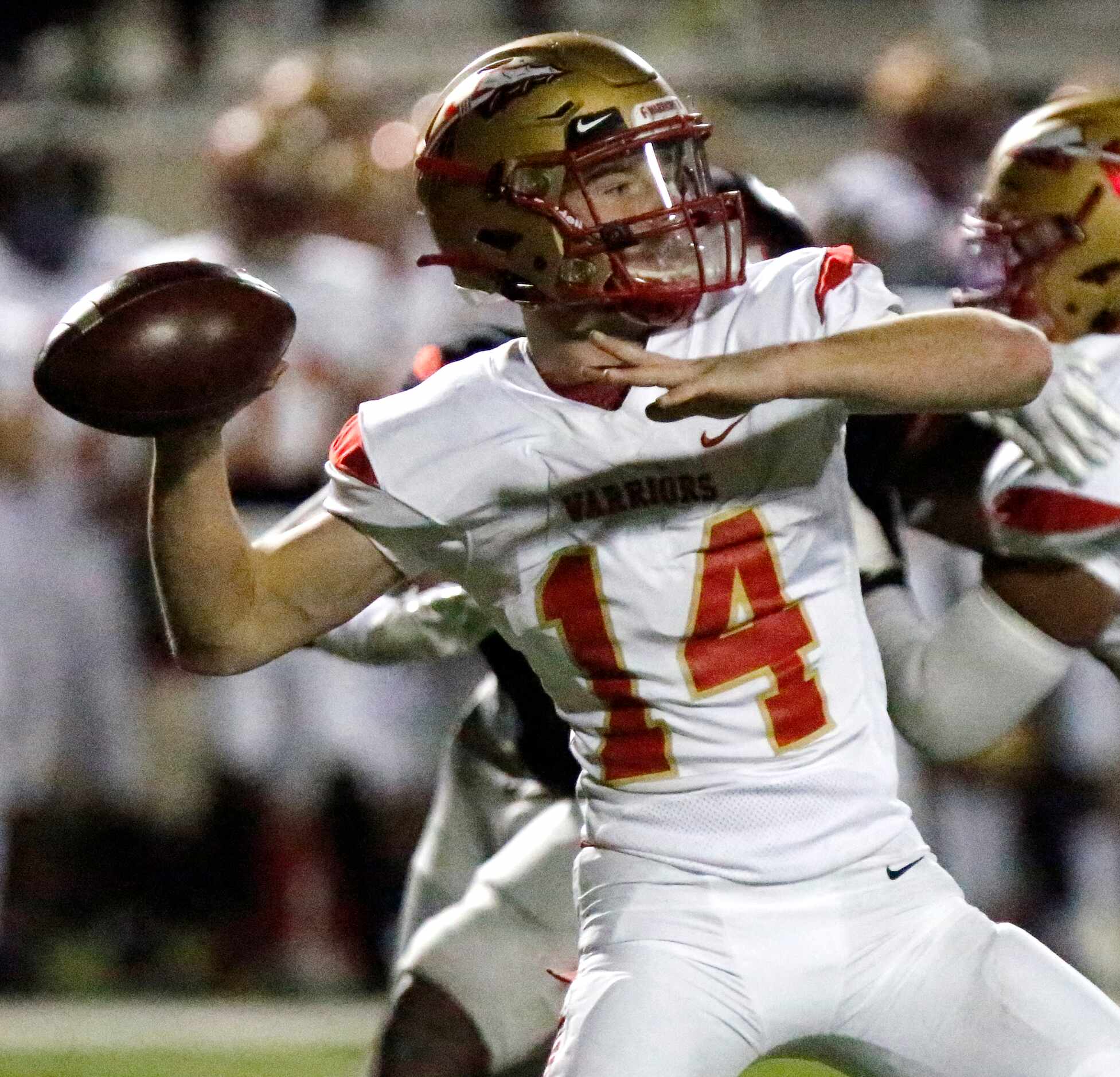 South Grand Prairie High School quarterback Sean Stegall (14) throws a pass during the first...