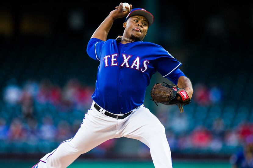 Texas Rangers starting pitcher Edinson Volquez (36) pitches during the first inning of a...