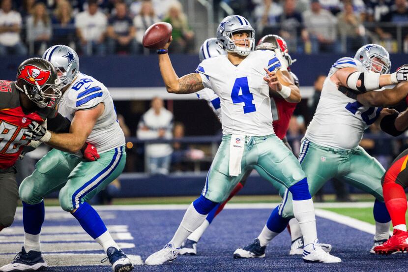 Dallas Cowboys quarterback Dak Prescott (4) throws a pass from the end zone during the...
