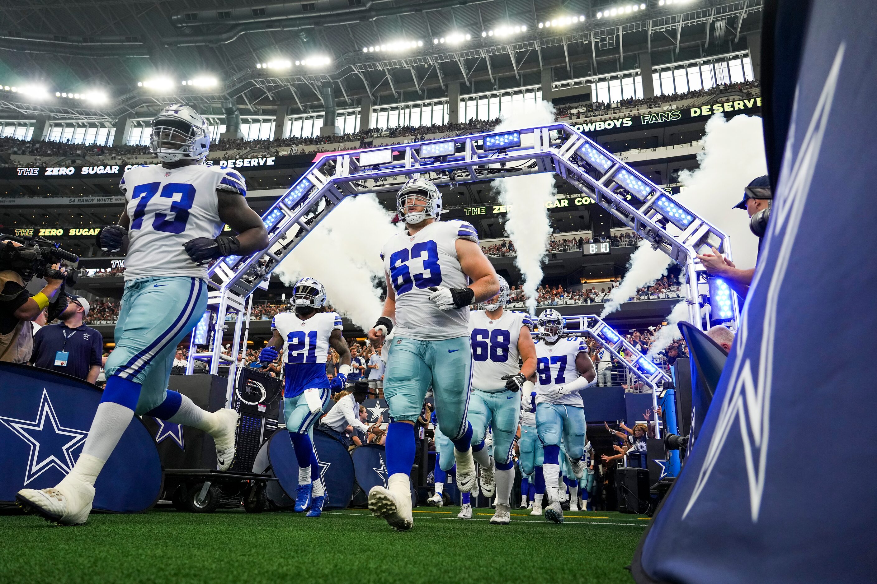 Dallas Cowboys offensive tackle Tyler Smith (73) and center Tyler Biadasz (63) take the...