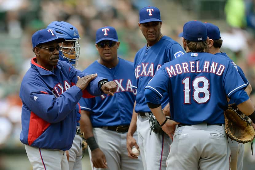 OAKLAND, CA - MAY 15:  Manager Ron Washington #38 of the Texas Rangers signals the bullpen...