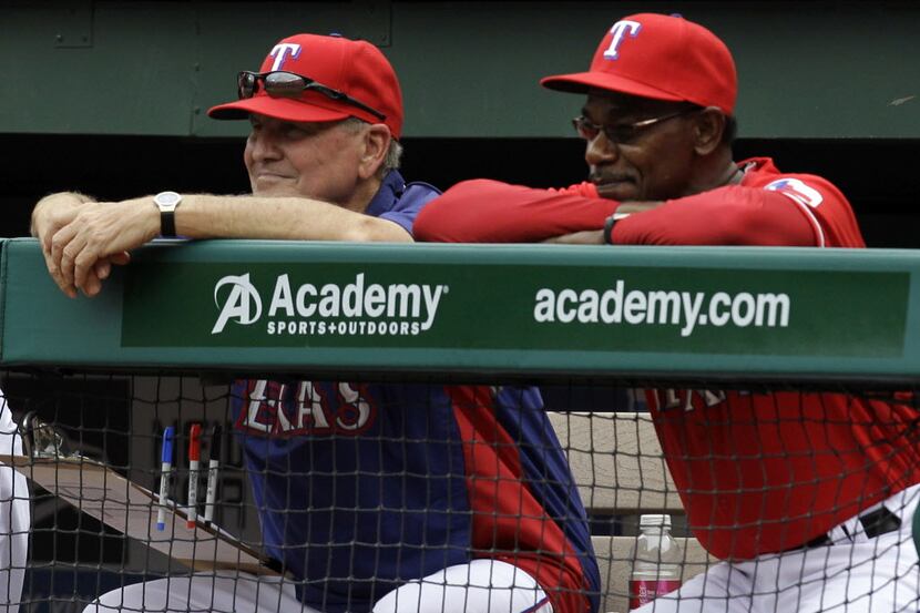 FILE - In this April 24, 2011, file photo, Texas Rangers bench coach Jackie Moore, left, and...