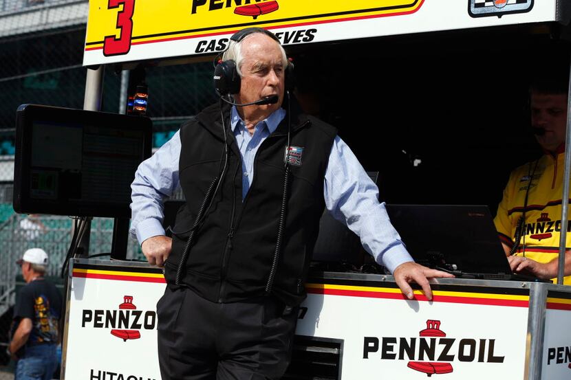 Car owner Roger Penske watch from the pit box during a practice session for the Indianapolis...