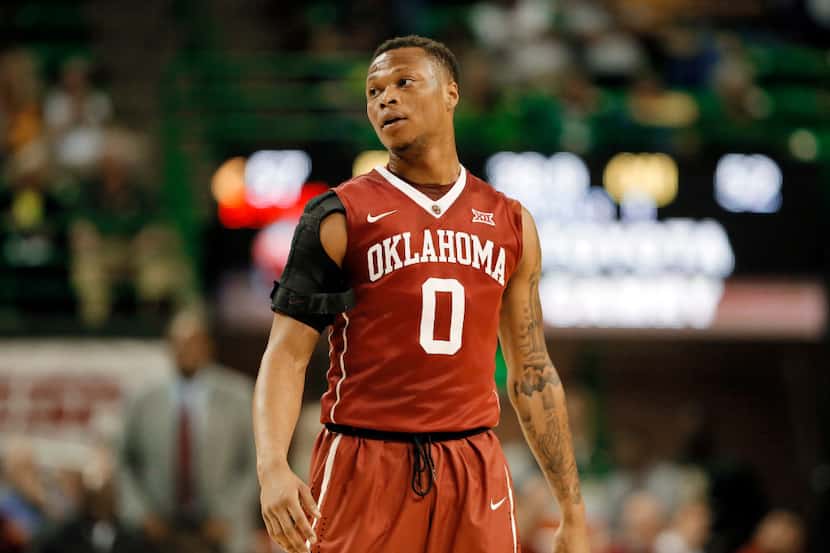 Oklahoma's Darrion Strong-Moore walks onto the court during an NCAA college basketball game...