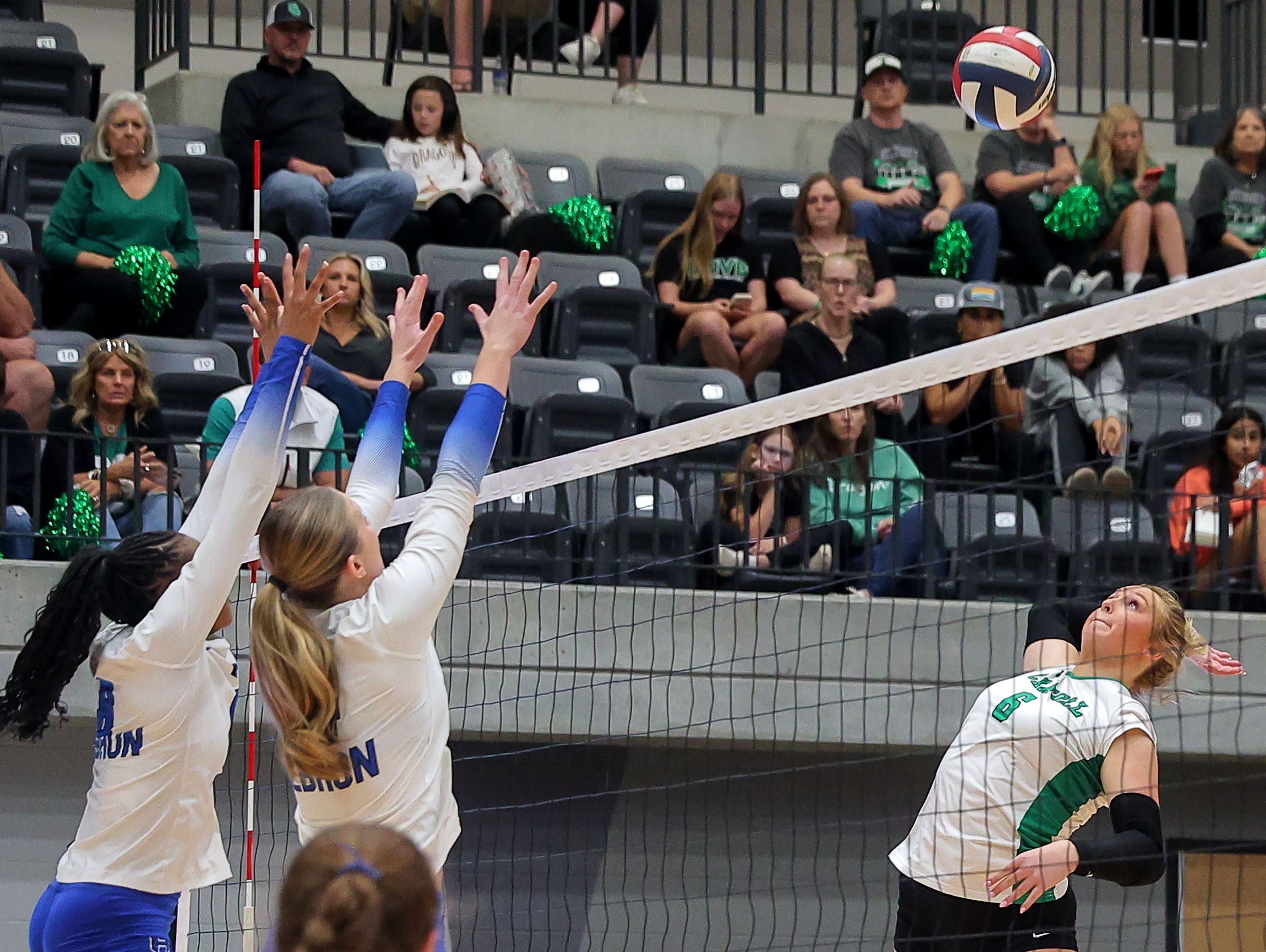 Southlake Carroll's Mary Beth Morse (6) attempts a kill against Hebron's Haley Kerstetter...