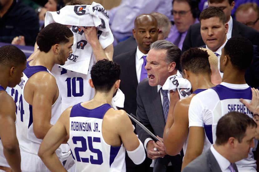 Texas Christian head coach Jamie Dixon makes a point to his team during a timeout in the...