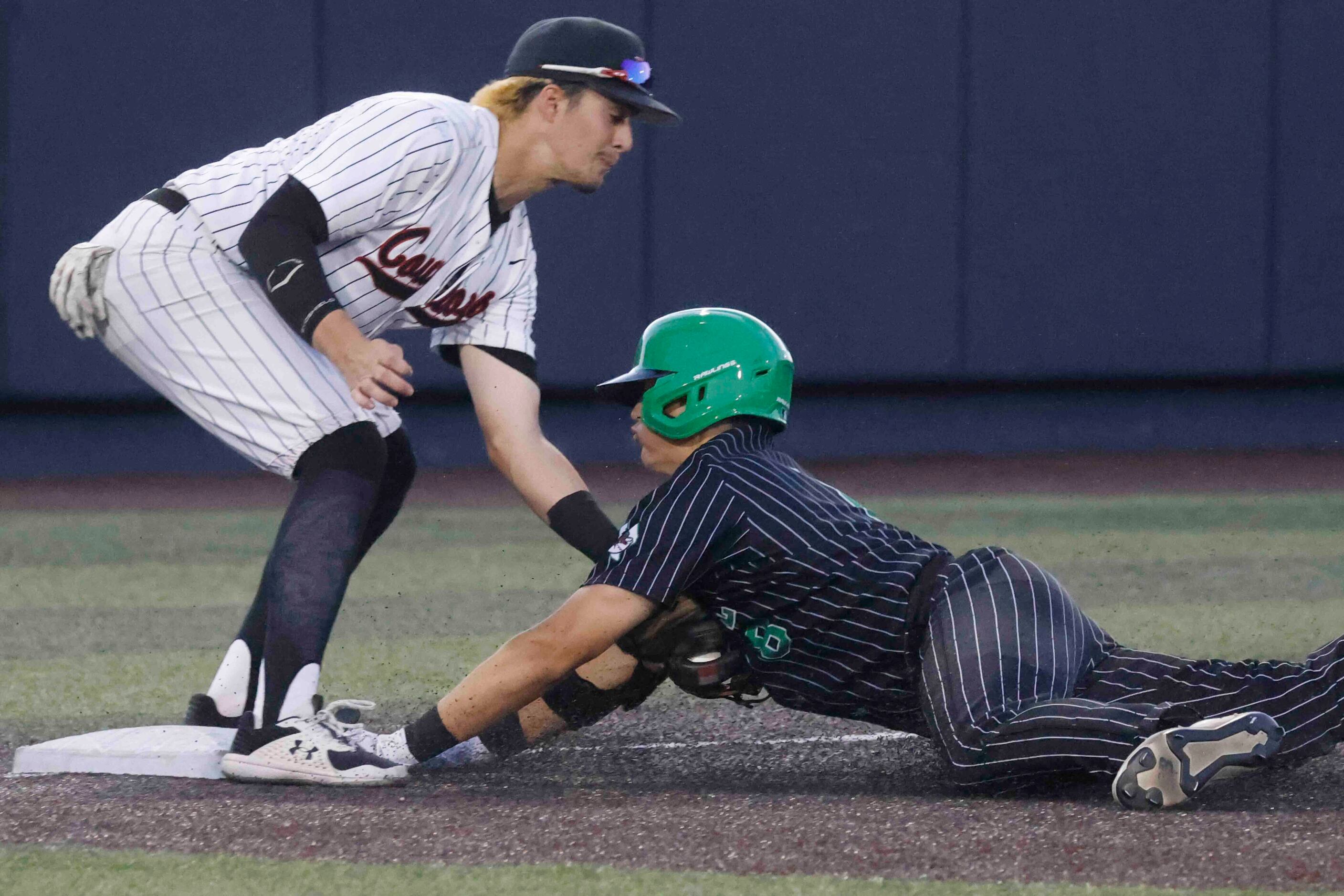 Southlake Carroll’s Ben Tryon, right, misses to touch the fourth base past Coppell’s Tanner...