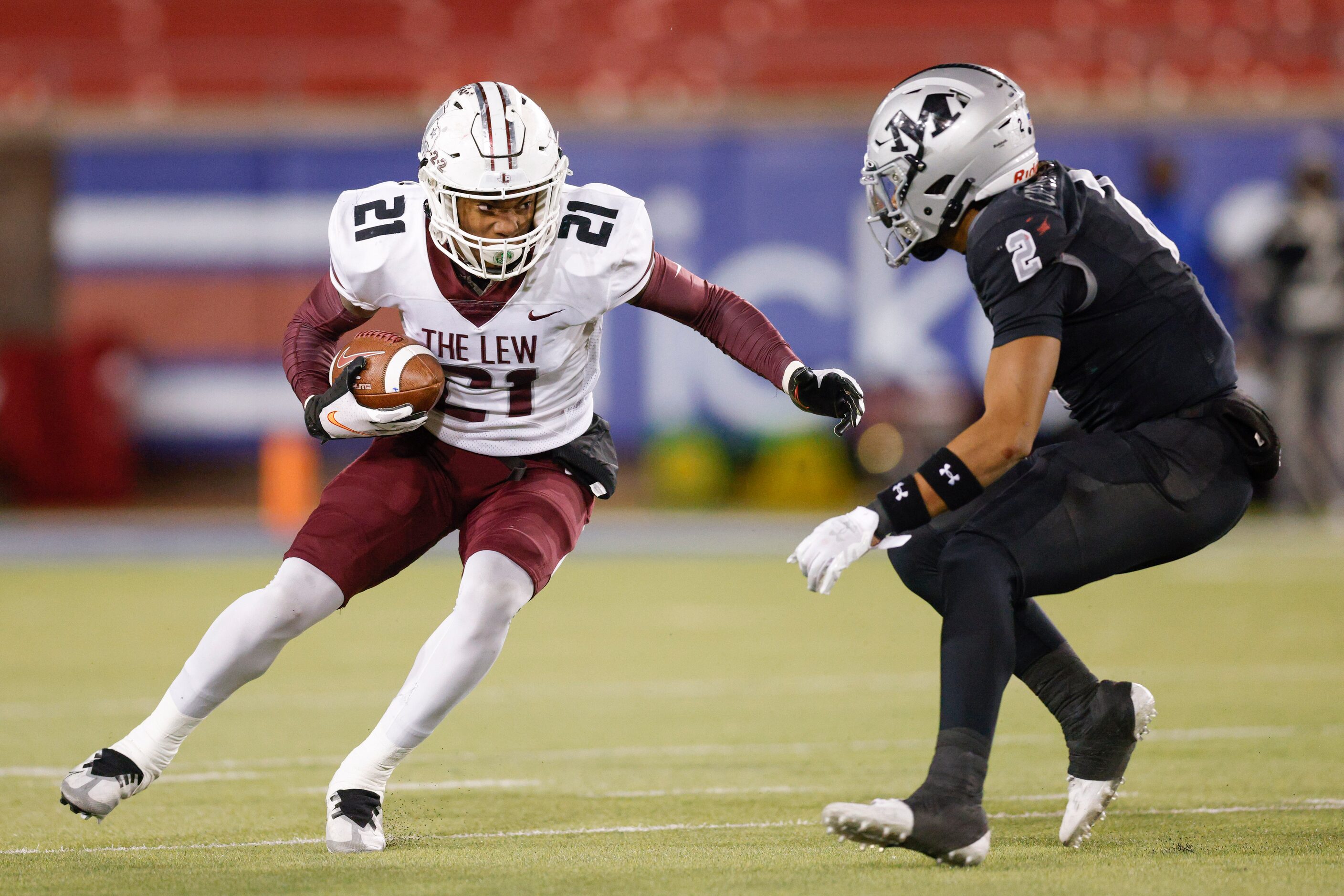 Lewisville running back Viron Ellison (21) makes a cut around Arlington Martin defensive...