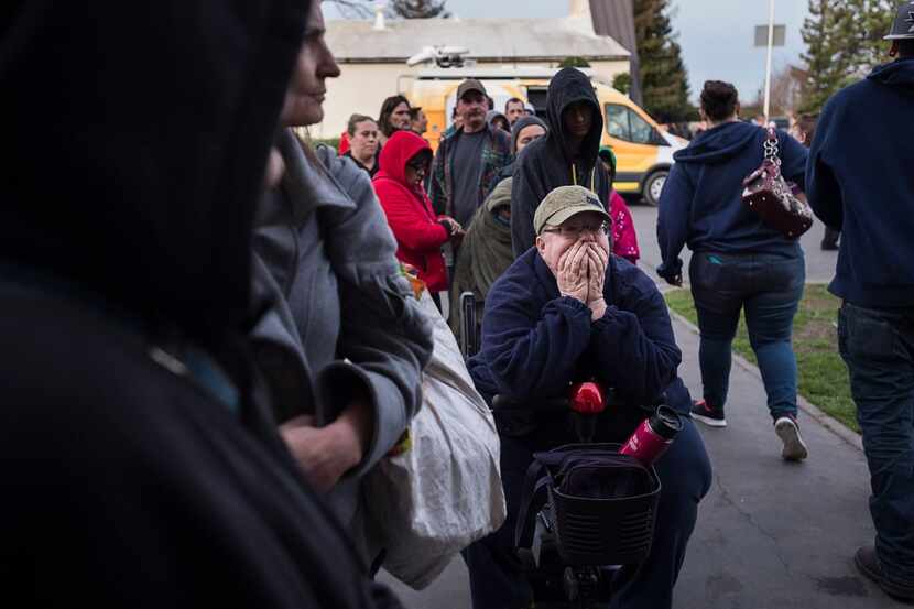 Paula Gillock, 53, waits in line for breakfast at the Silver Dollar Fairgrounds on Monday,...