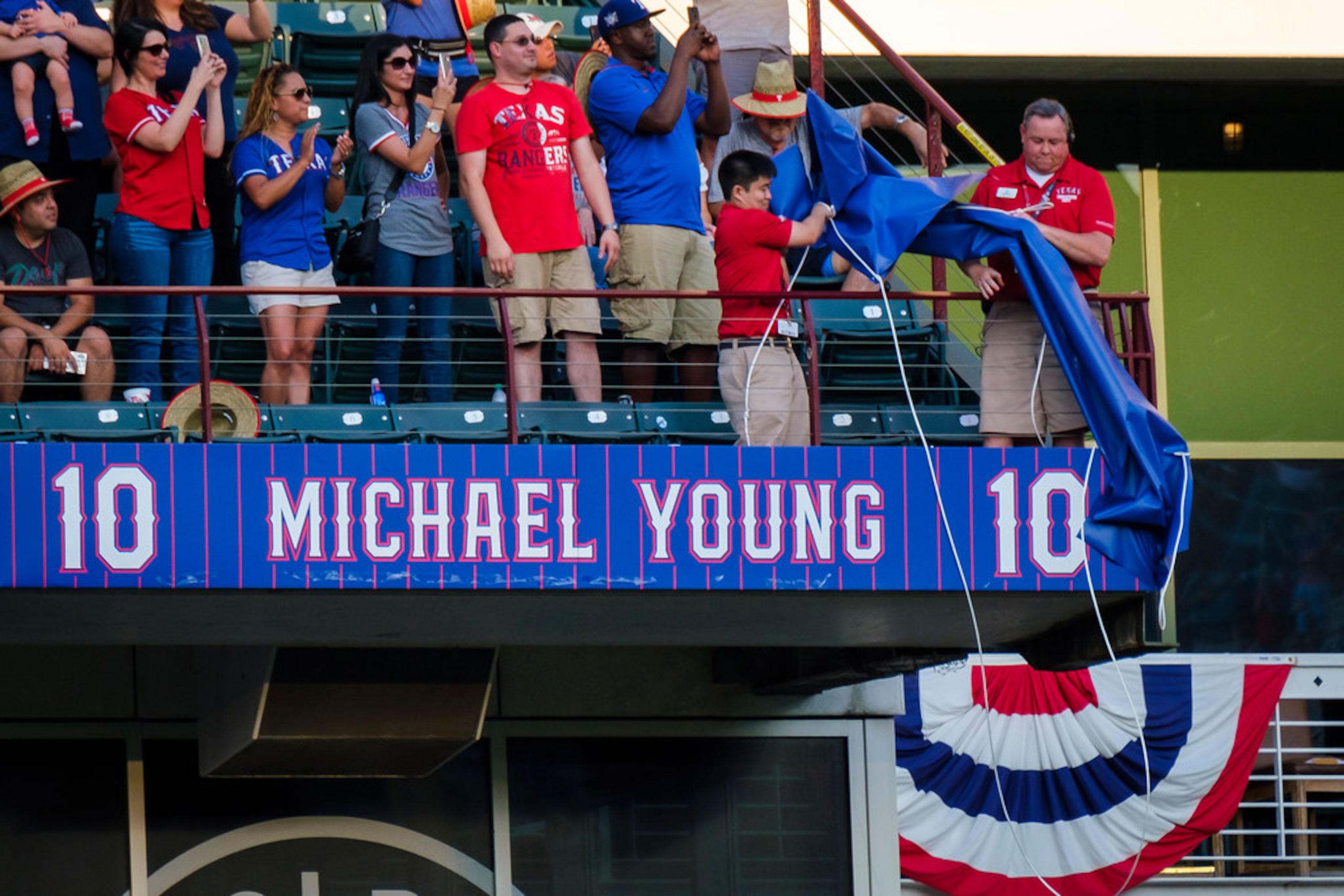 Michael YoungÃs number is uncovered during ceremonies to retire Young's No. 10 before a...