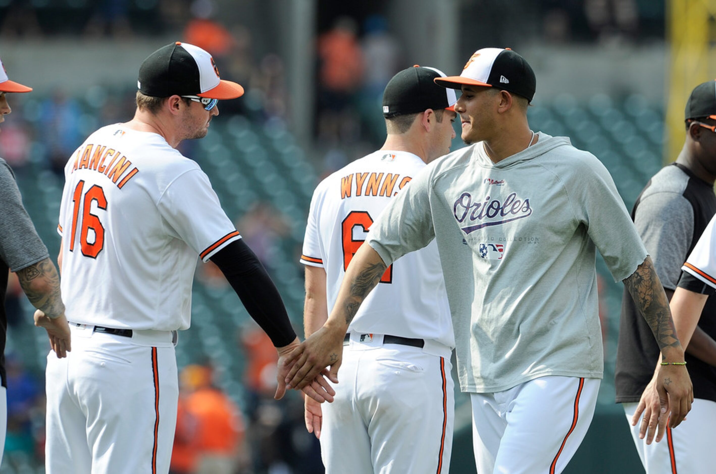 BALTIMORE, MD - JULY 15:  Manny Machado #13 of the Baltimore Orioles celebrates with Trey...