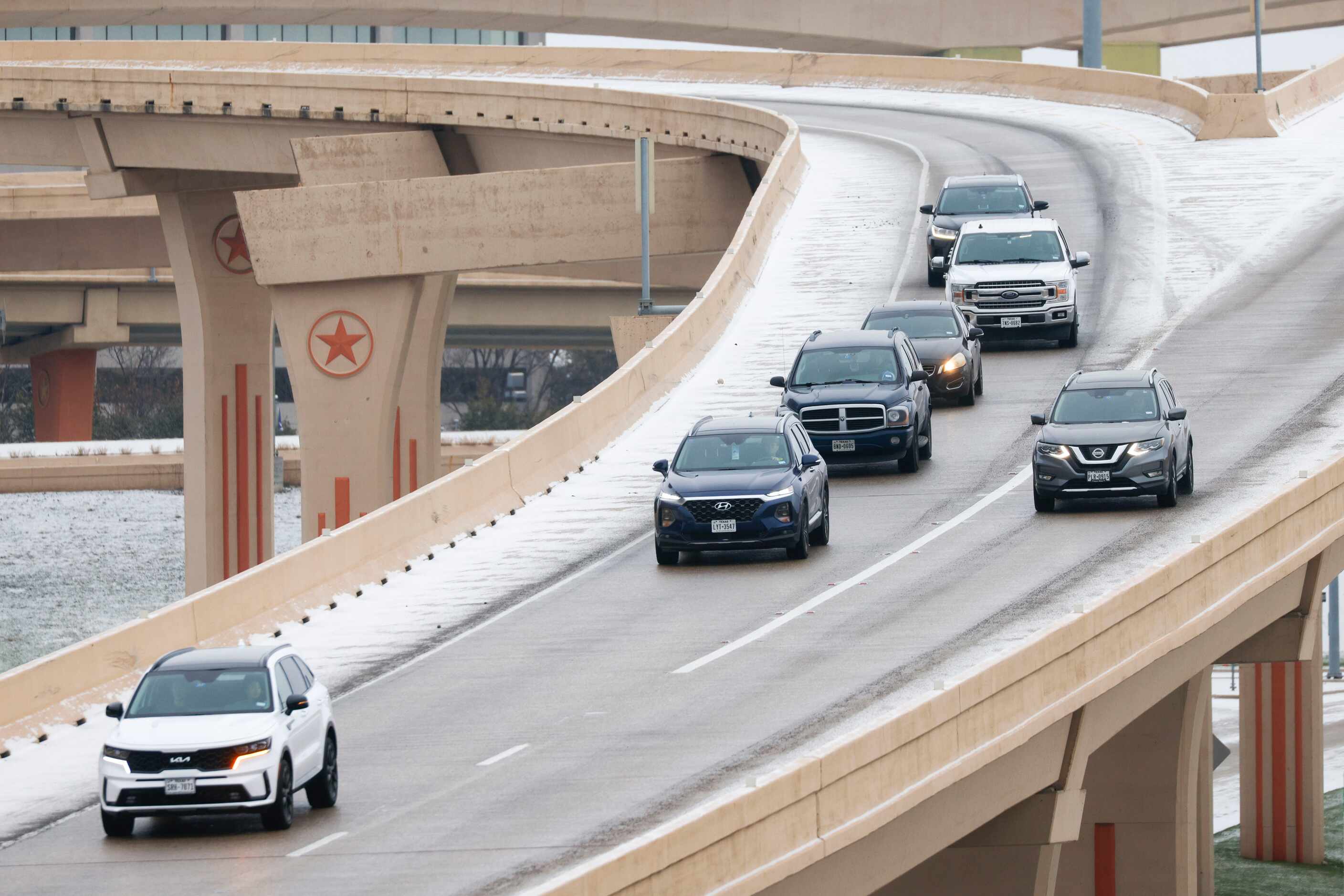 Traffic travel through icy condition on U.S. 75, near High Five Interchange as Monday, Jan....