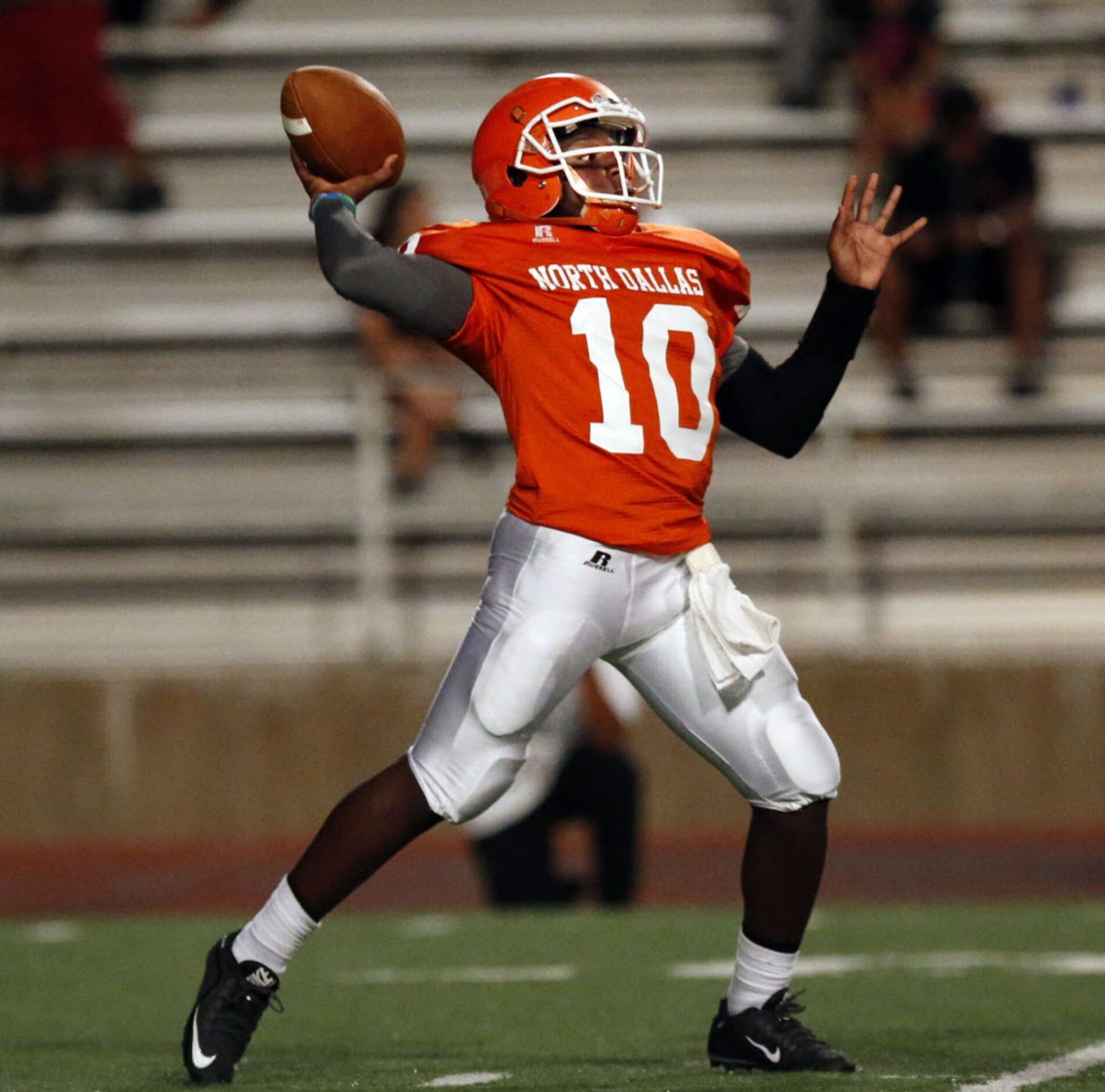 (TXHSFB) North Dallas High QB KaVon Price (10) throws a long pass during the first half of a...