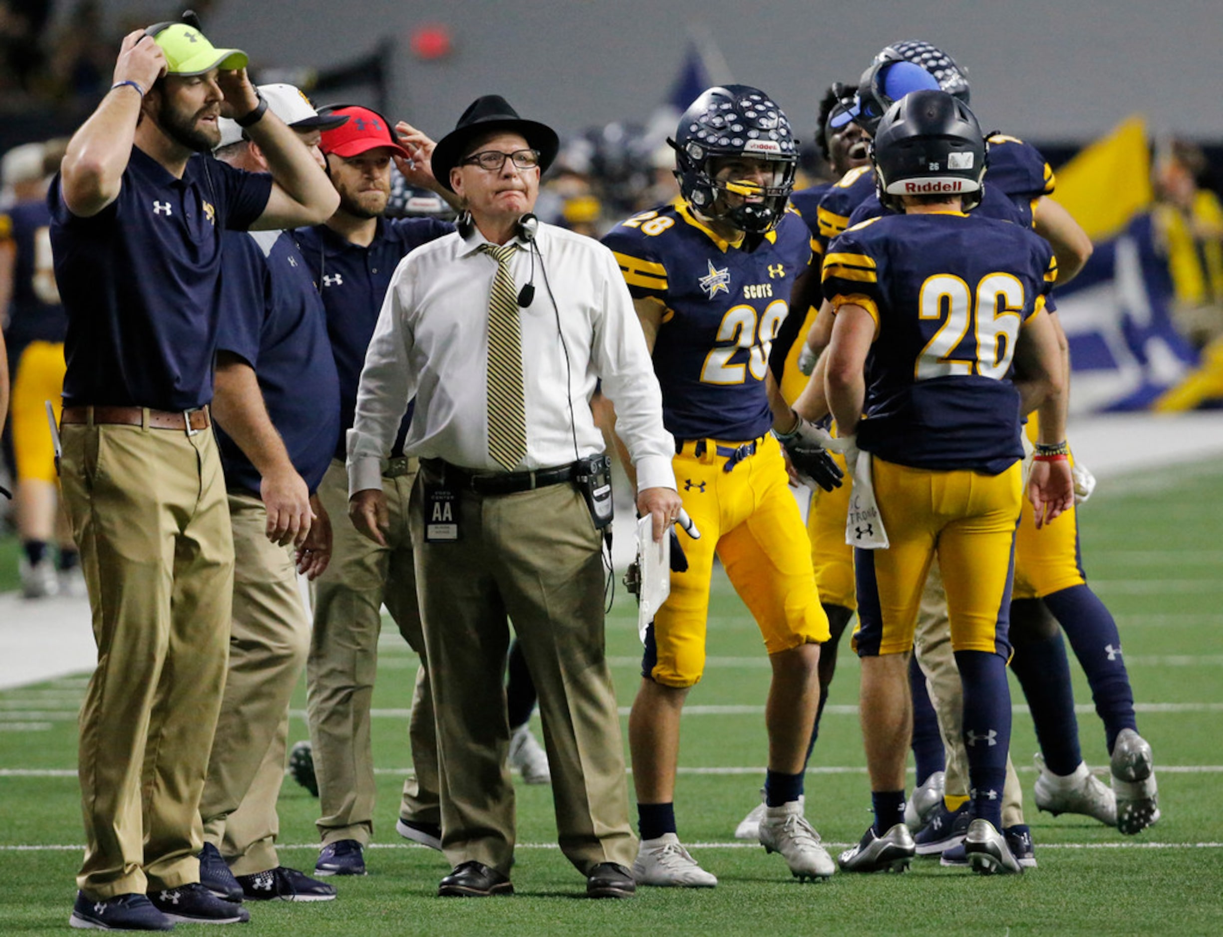 Scots head coach Randy Allen directs hois troops late in the game after the winning score...