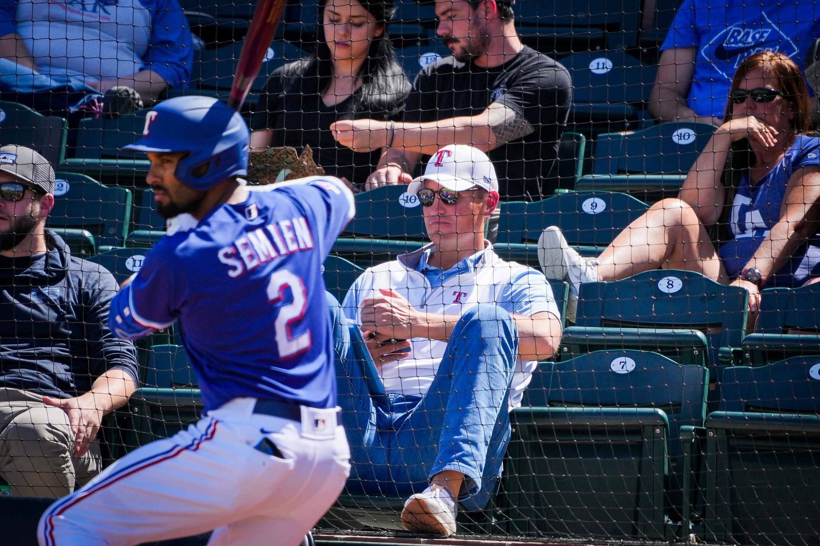 Texas Rangers executive vice president & general manager Chris Young watches from the stands...