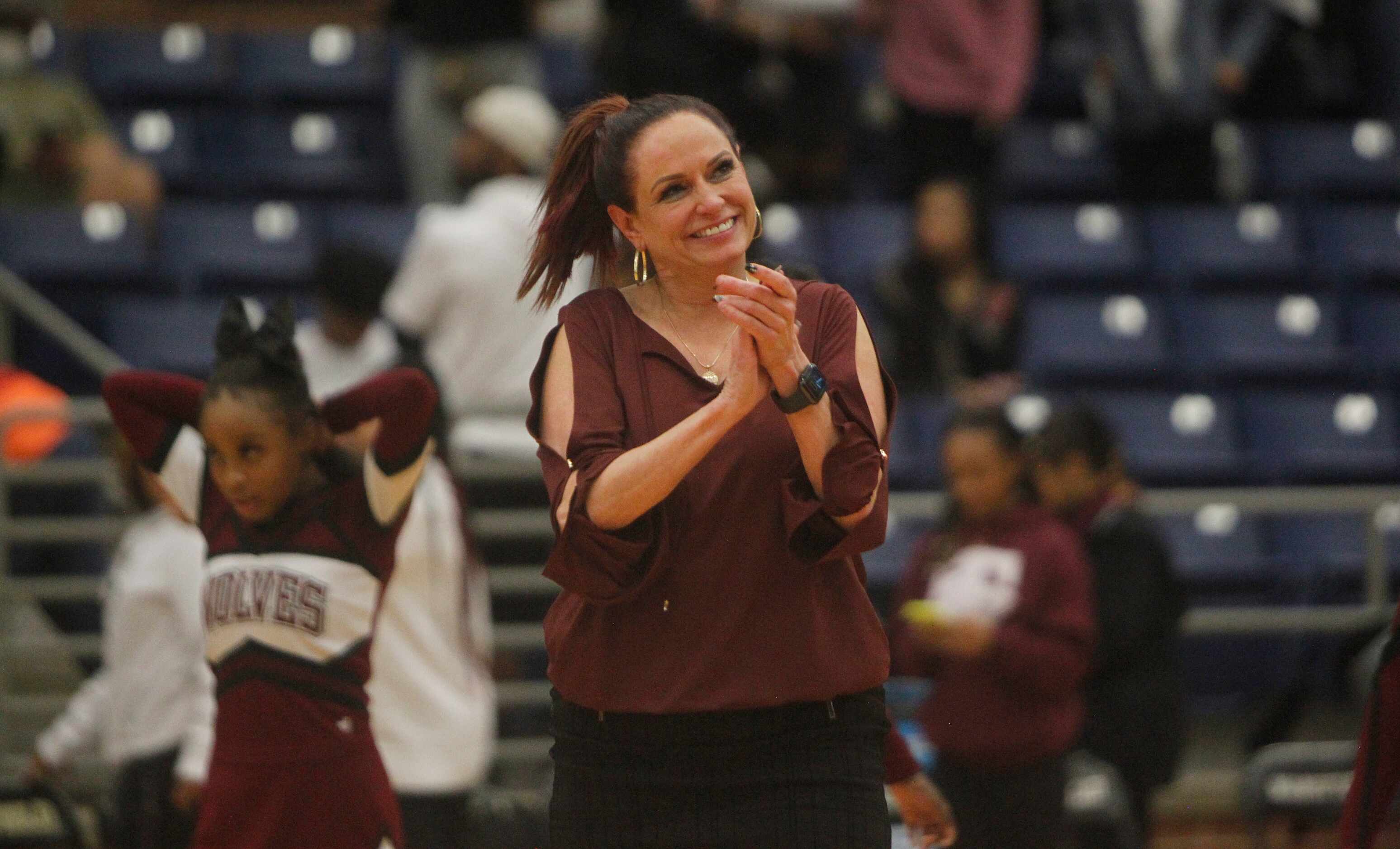 Mansfield Timberview head coach Kit Kyle-Martin beams as she acknowledges applause from fans...