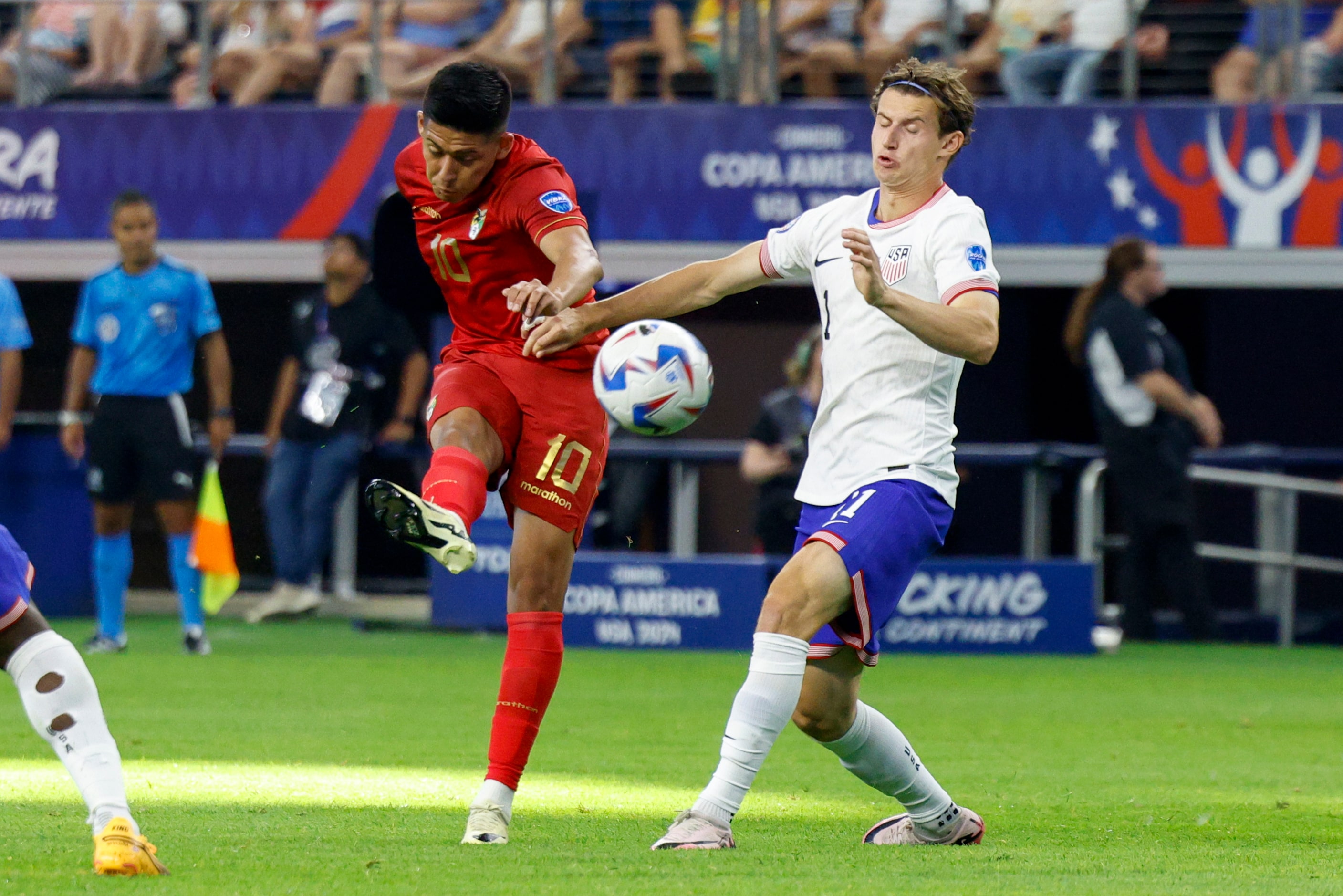 Bolivia midfielder Ramiro Vaca (10) shoots past United States midfielder Brenden Aaronson...