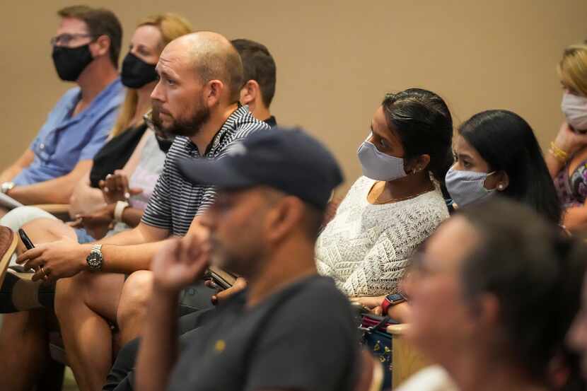 People listen to public comment during the Carroll ISD school board meeting on Monday, Aug....