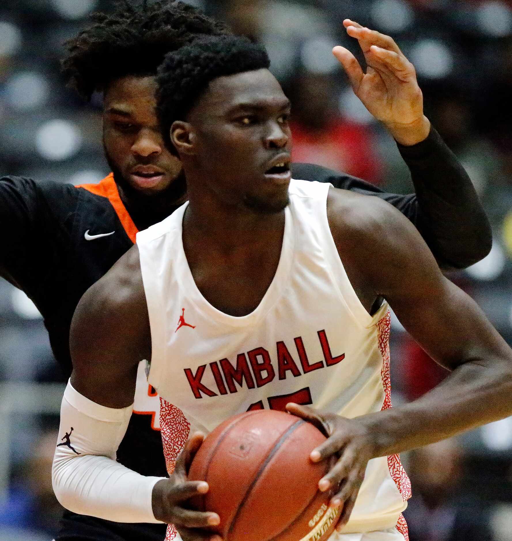 Kimball High School forward Kyron Henderson (15) looks to pass in front of Lancaster High...