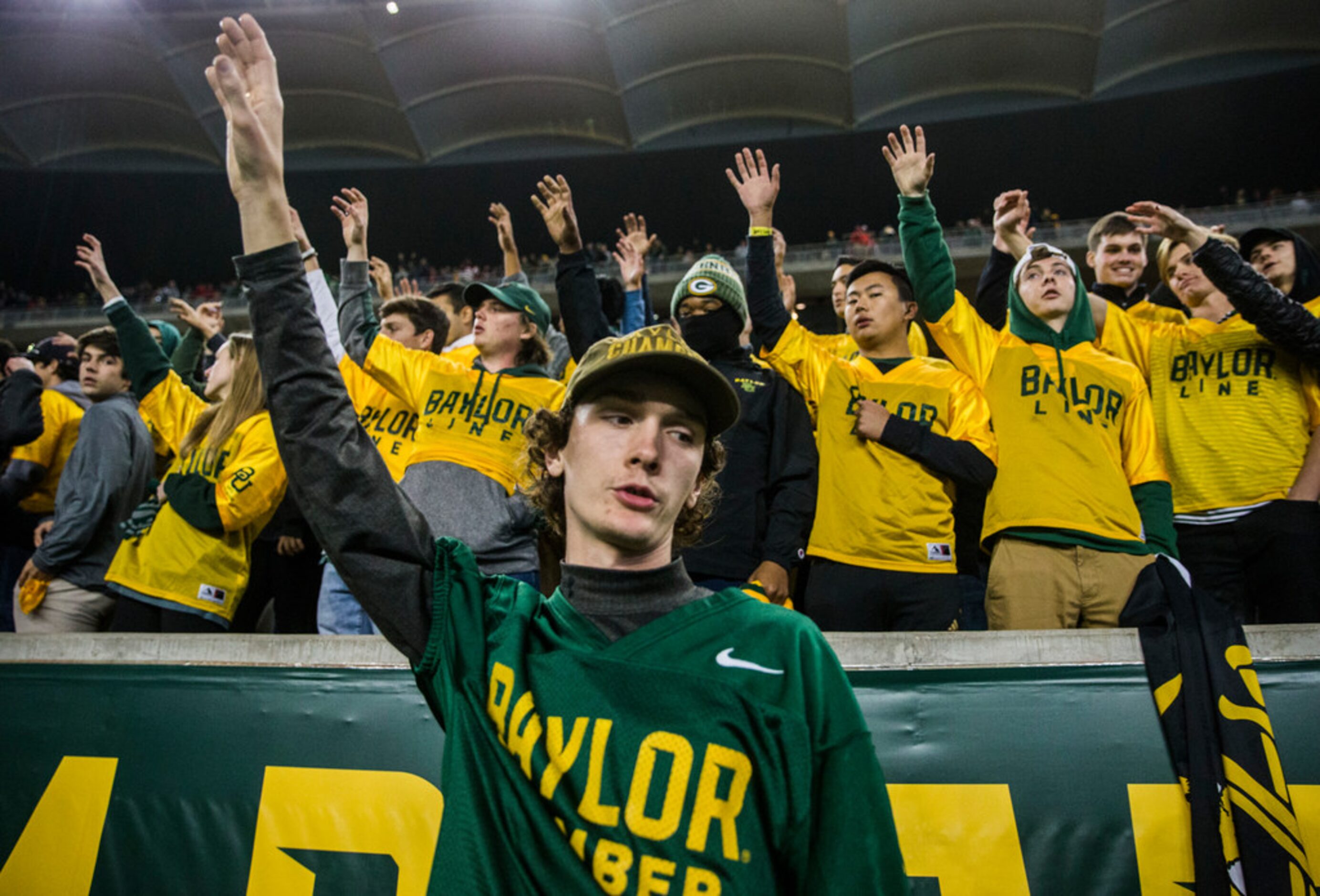 Baylor Bears fans sing the school song after losing 34-31 to the Oklahoma Sooners after an...