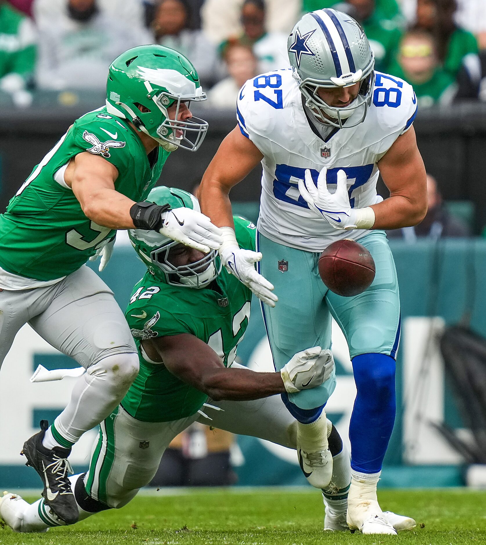 Dallas Cowboys tight end Jake Ferguson (87) fumbles as he is hit by Philadelphia Eagles...