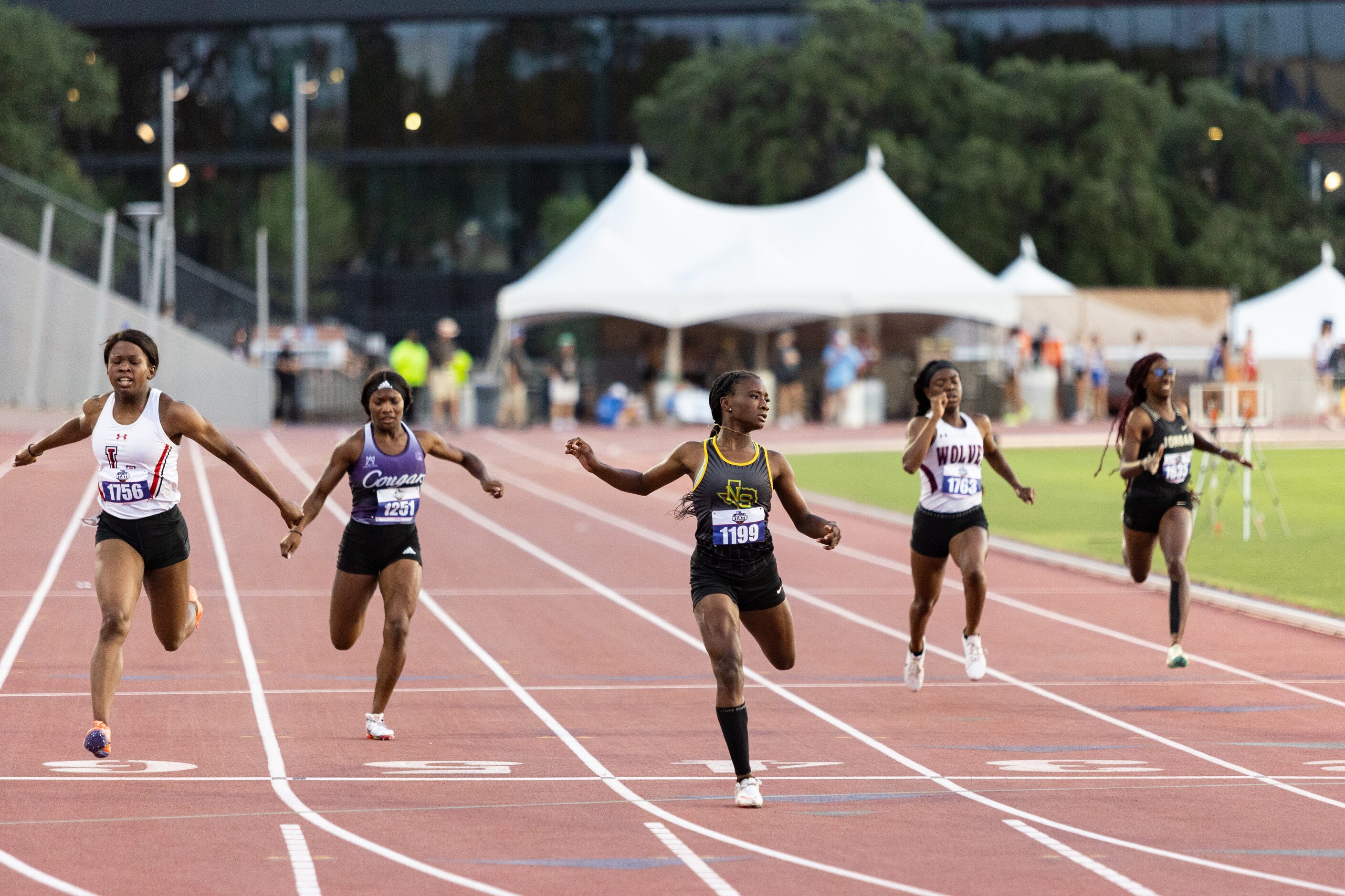 Aniyah Bigam of Carrollton Smith looks to the scoreboard for her time as she competes in the...