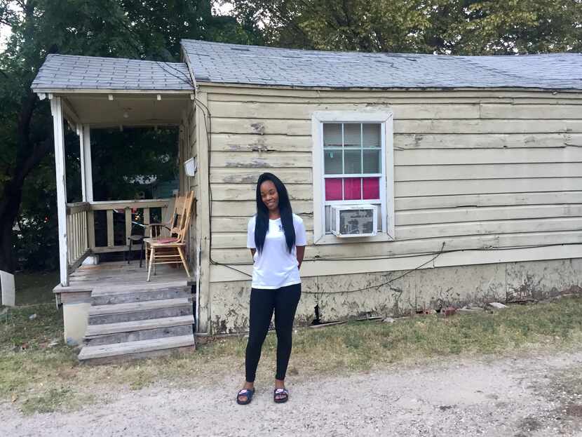 Ashton Elder stands before her newly purchased home. She was an HMK tenant until she bought...