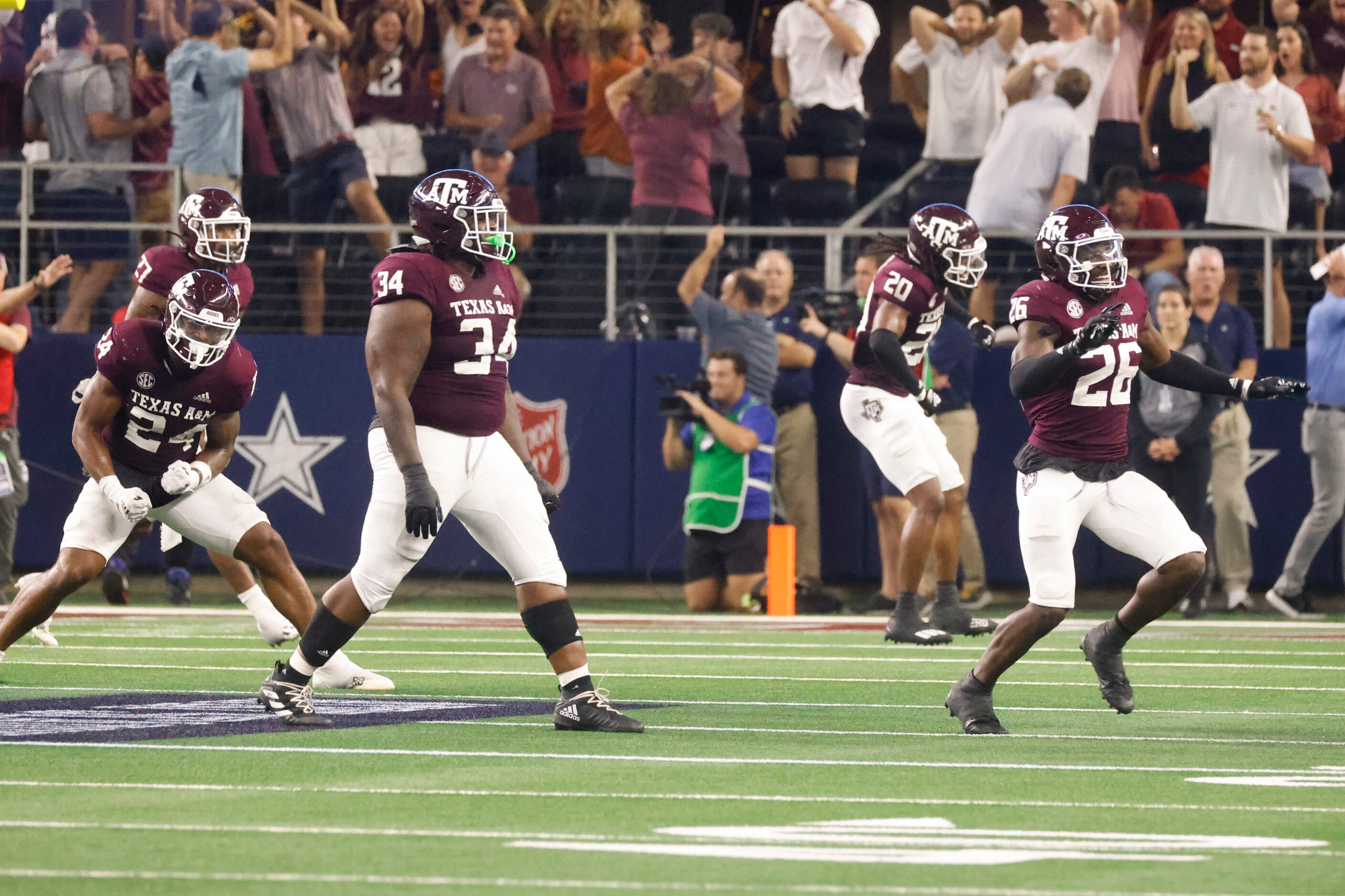 Texas A&M players celebrate as Arkansas misses to score from a field goal during the second...