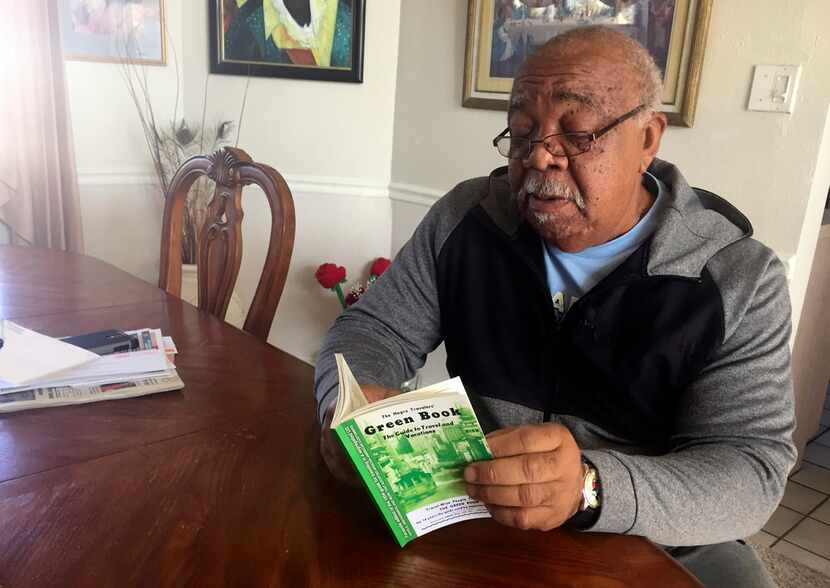 Charles Becknell Sr., 77, peruses a copy of the 1954 edition of The Negro Motorist Green...