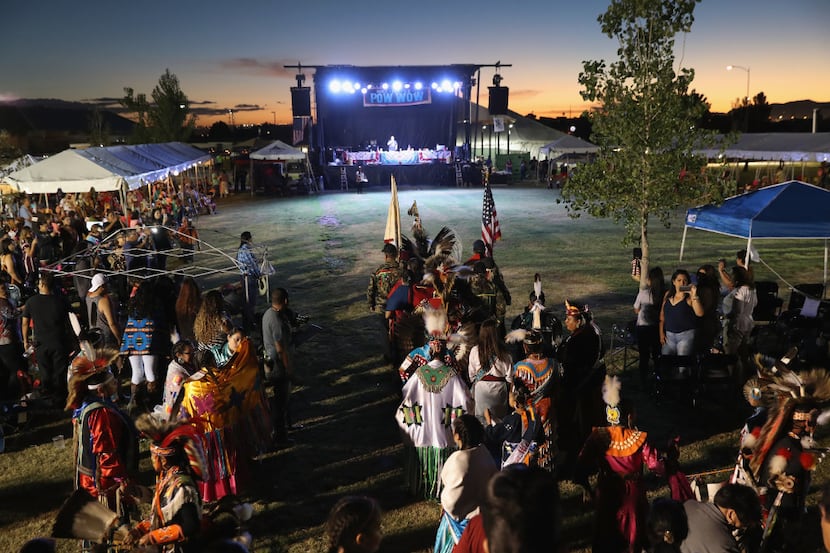 YSLETA DEL SUR PUEBLO, TX - OCTOBER 01:  Native American dancers follow the U.S. and tribal...